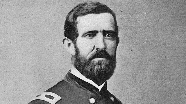 A black and white image of Thomas Welsh standing in his Union generals uniform.