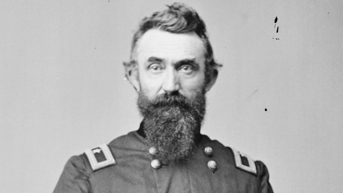 A black and white image of Nathan Kimball standing in his Union generals uniform.