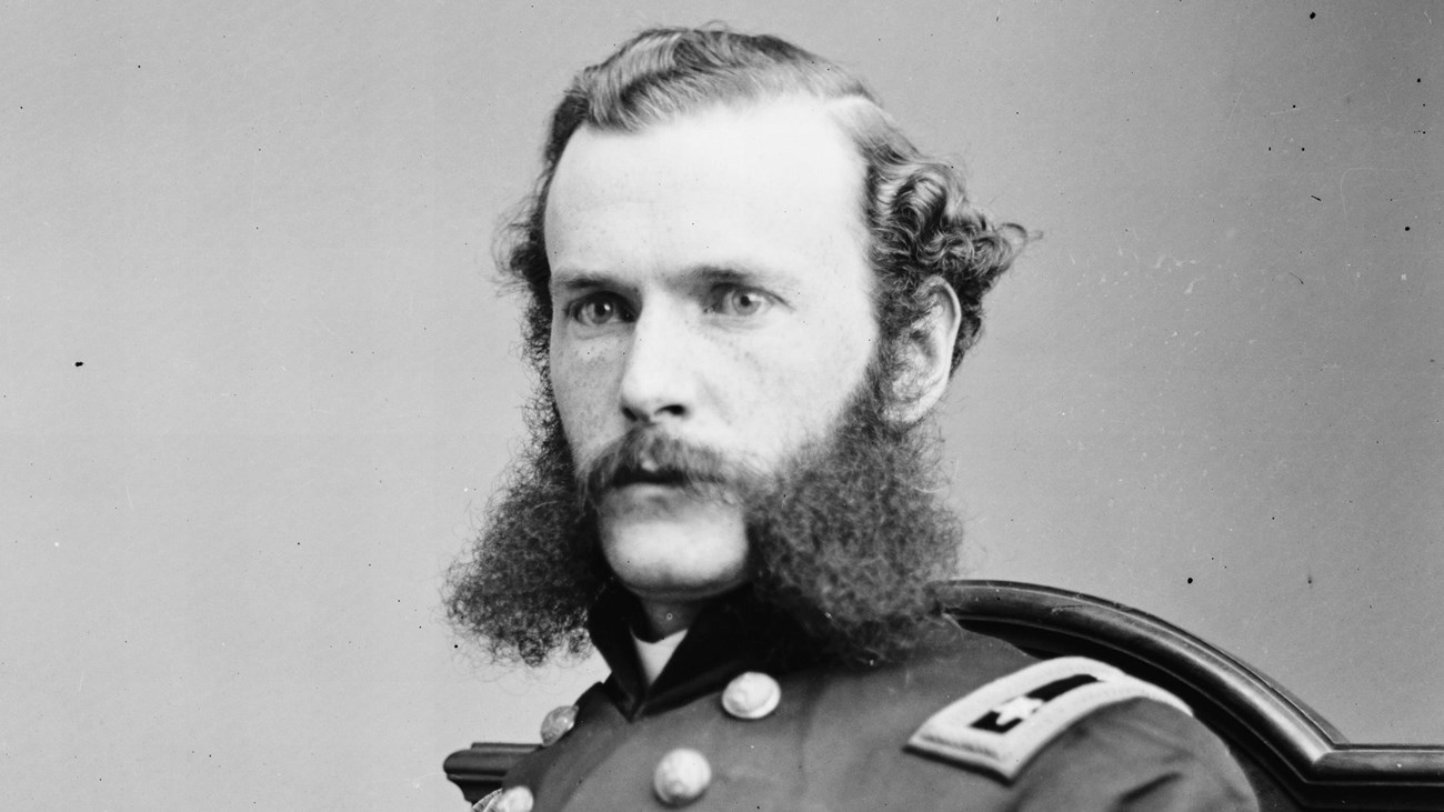 A black and white image of Francis Herron sitting in his Union generals uniform.