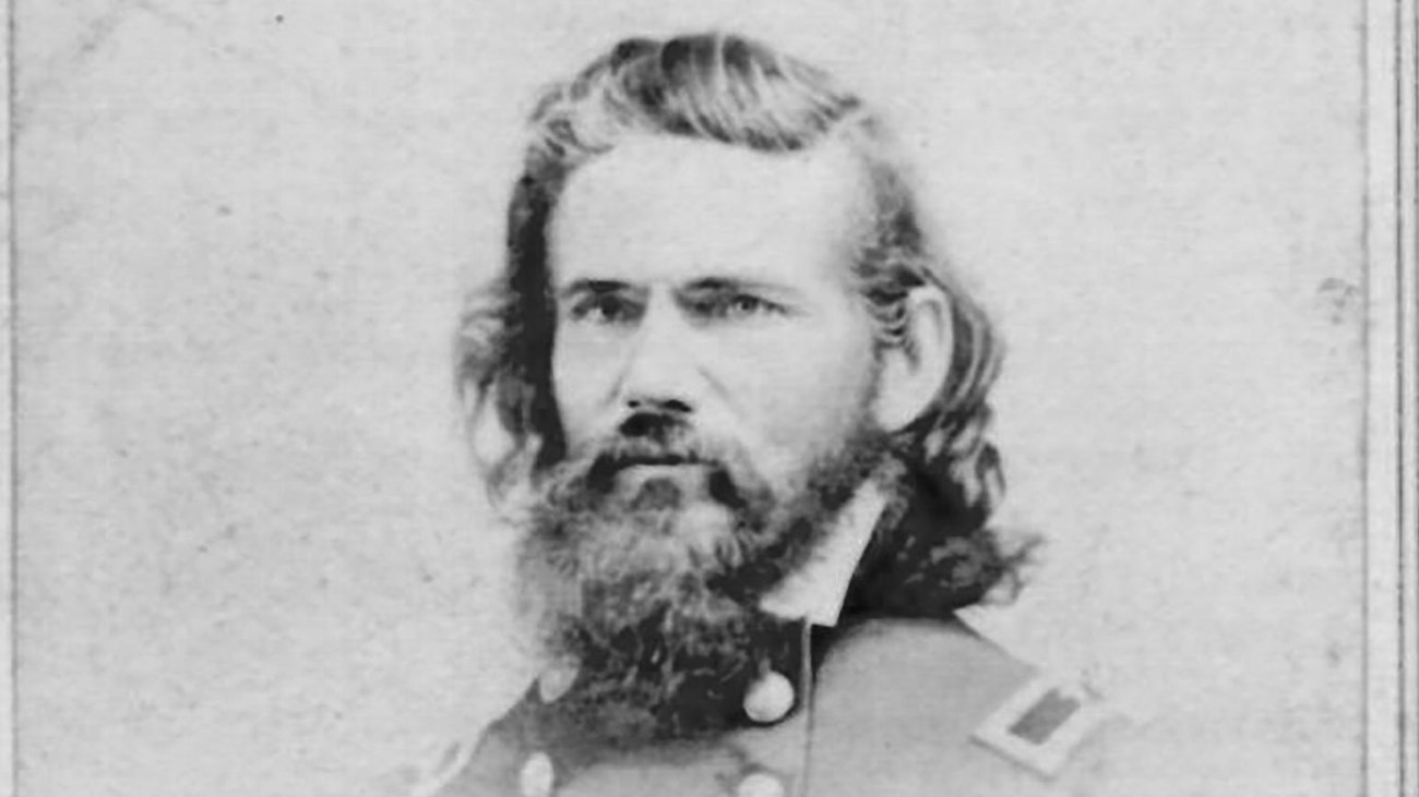 A black and white side profile image of Elias Dennis in his Union generals uniform.