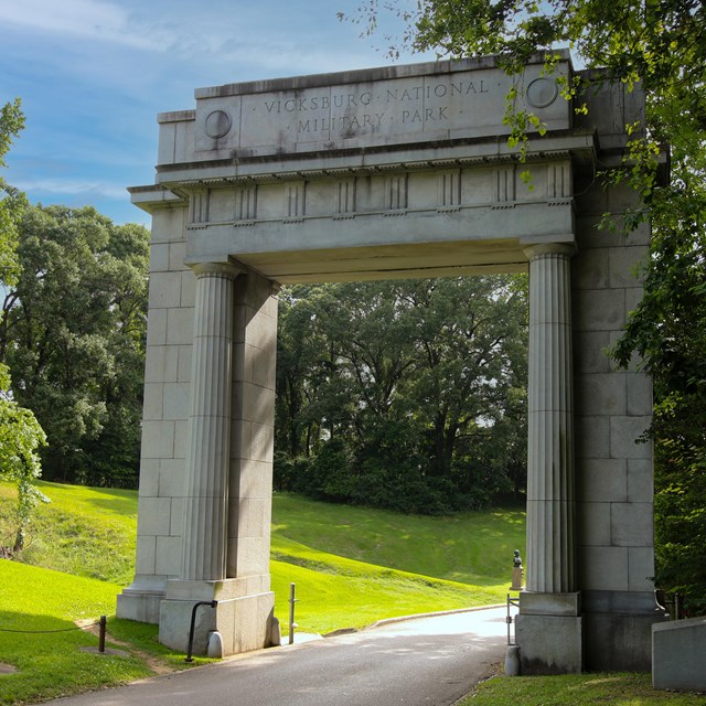 The large tall concrete Memorial Arch over the entrance of the tour road