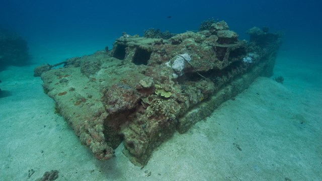 The wreck of an Amtrac amphibious tractor on the ocean floor.
