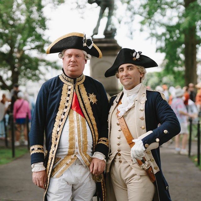 Reenactors portraying Lafayette and Rochambeau stand in Washington Square 