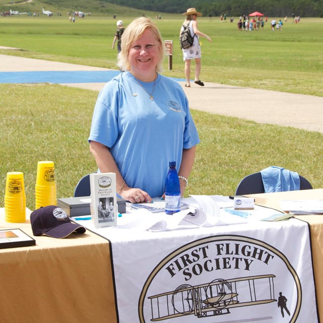 First Flight Society member at outdoor booth