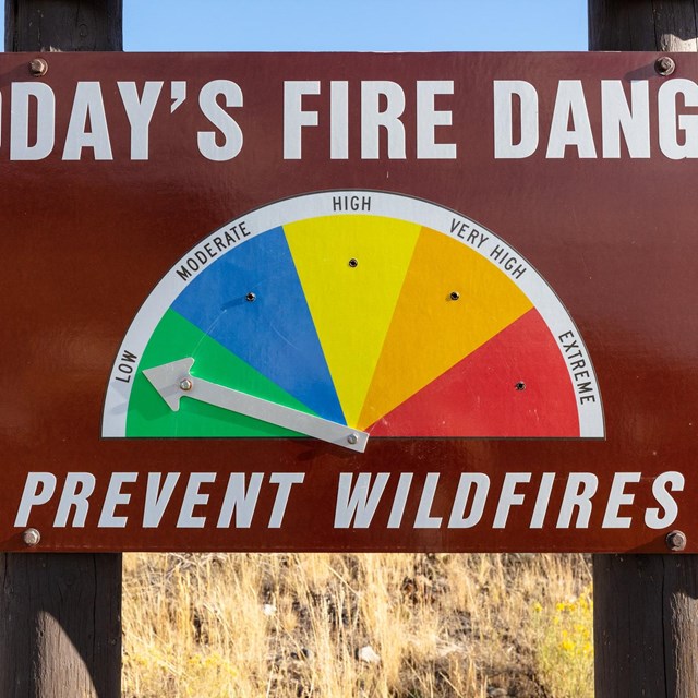 a fire danger sign that reads: 