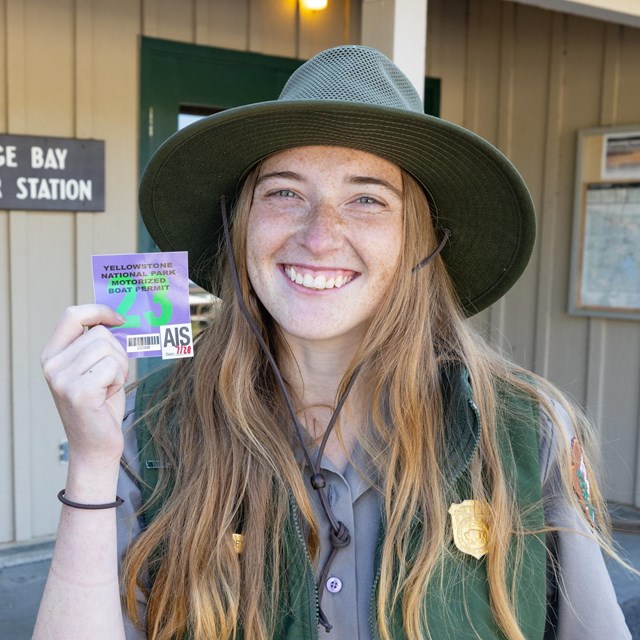 Ranger holding a boating permit
