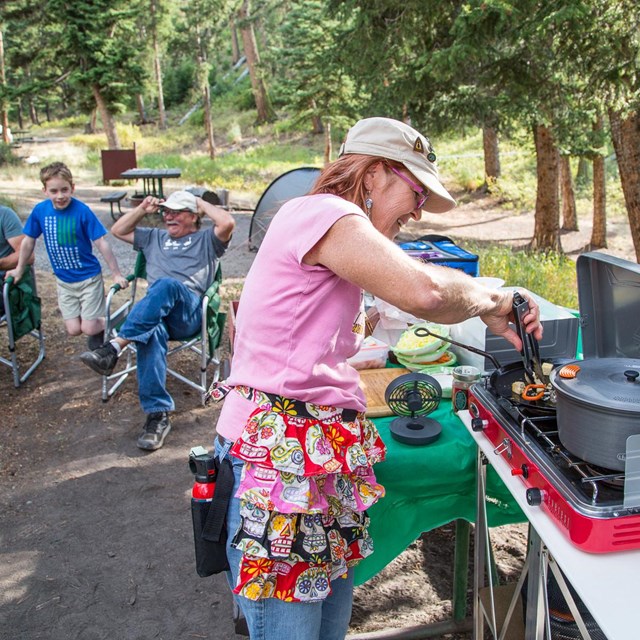 Campers preparing dinner in the Tower Campground