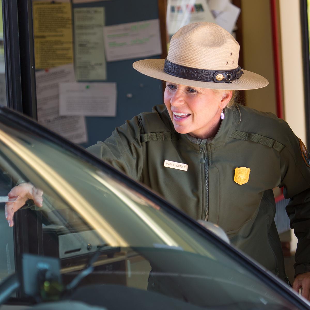 Photo of a park ranger at an entrance station