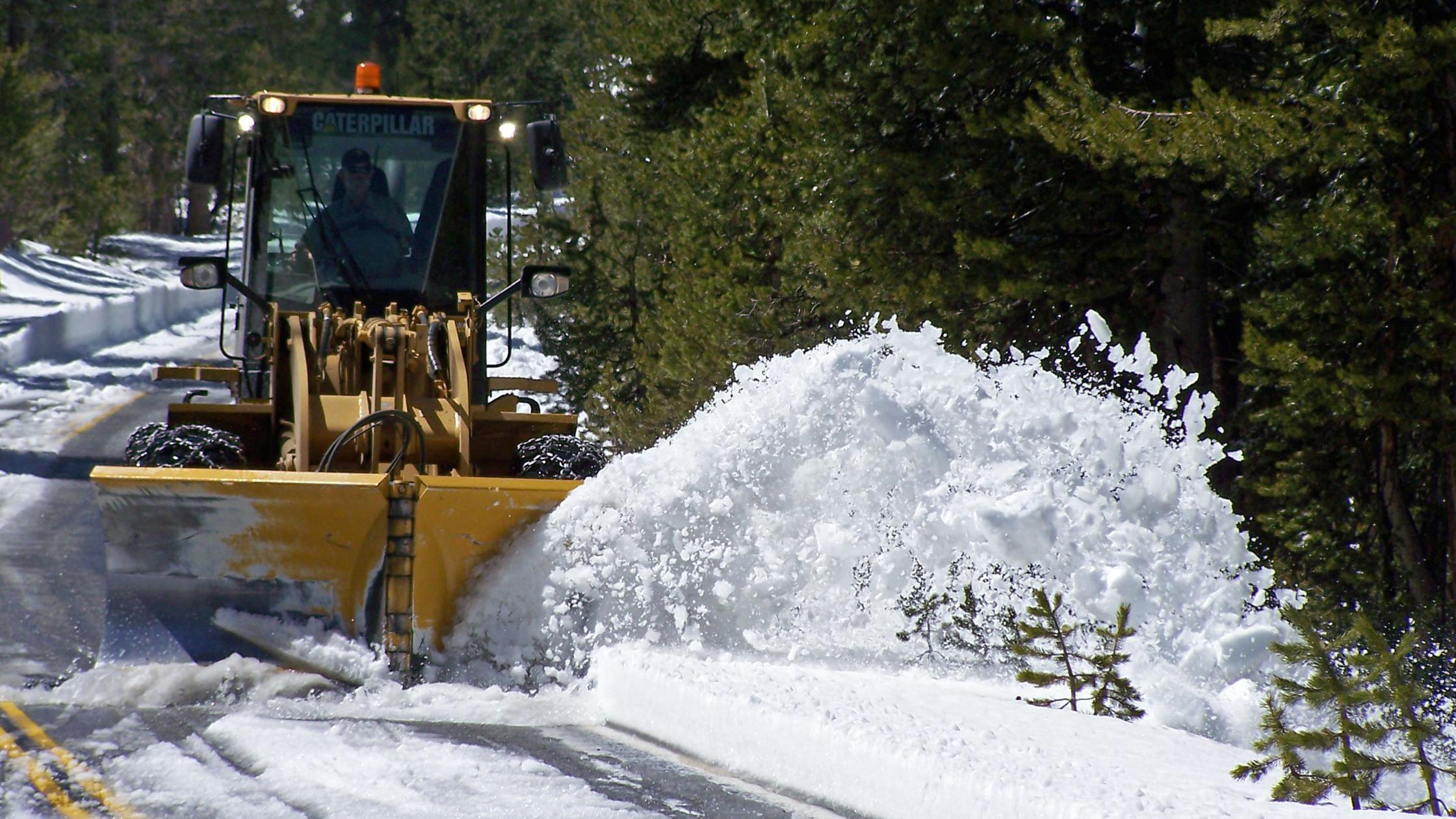 Snowplow plowing snow