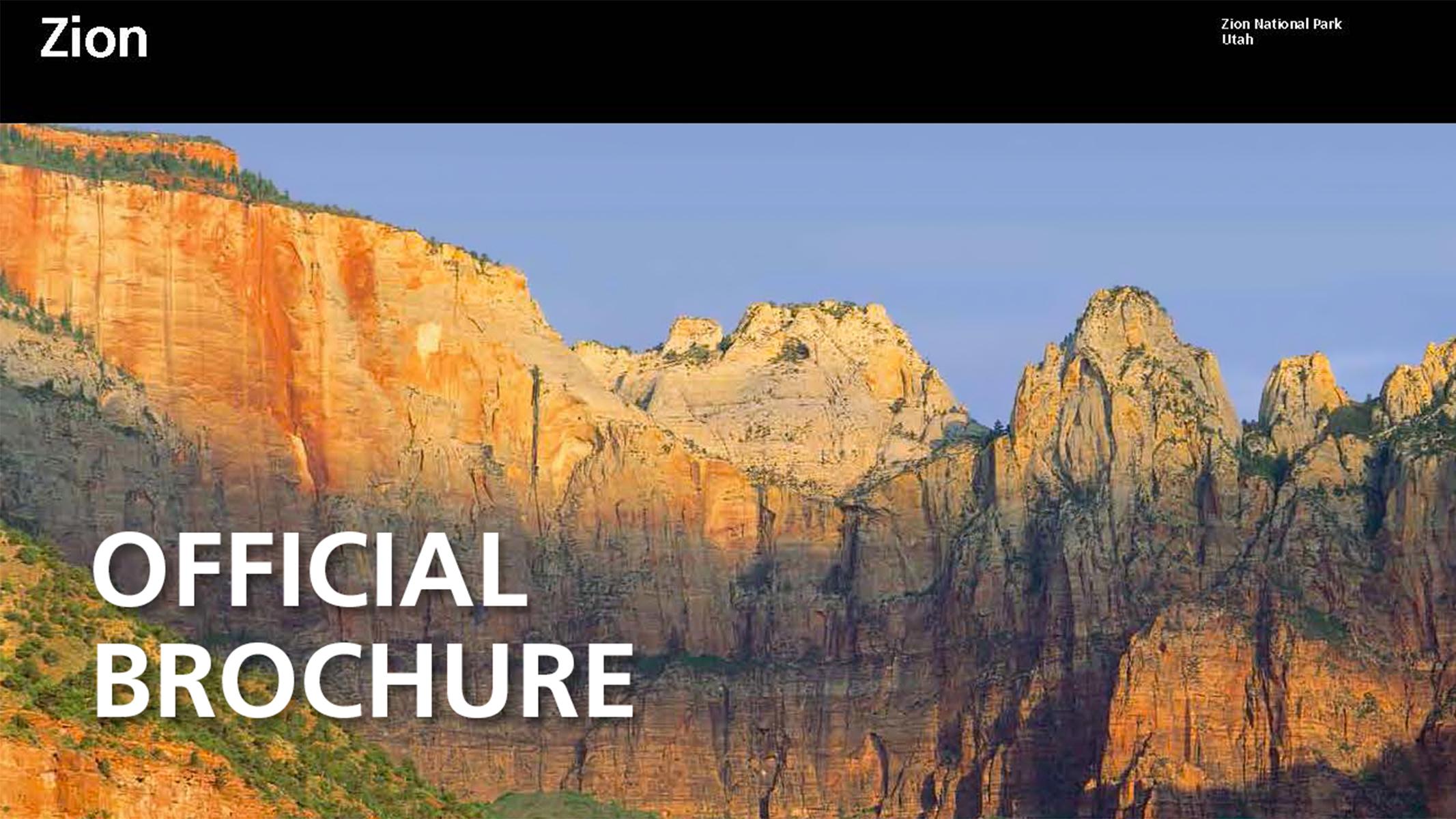 A blue sky over sandstone mountains with text reading "Official Brochure."