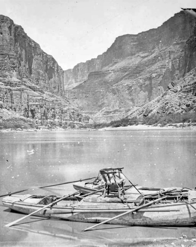 Rowing boat with chair on river with cliffs