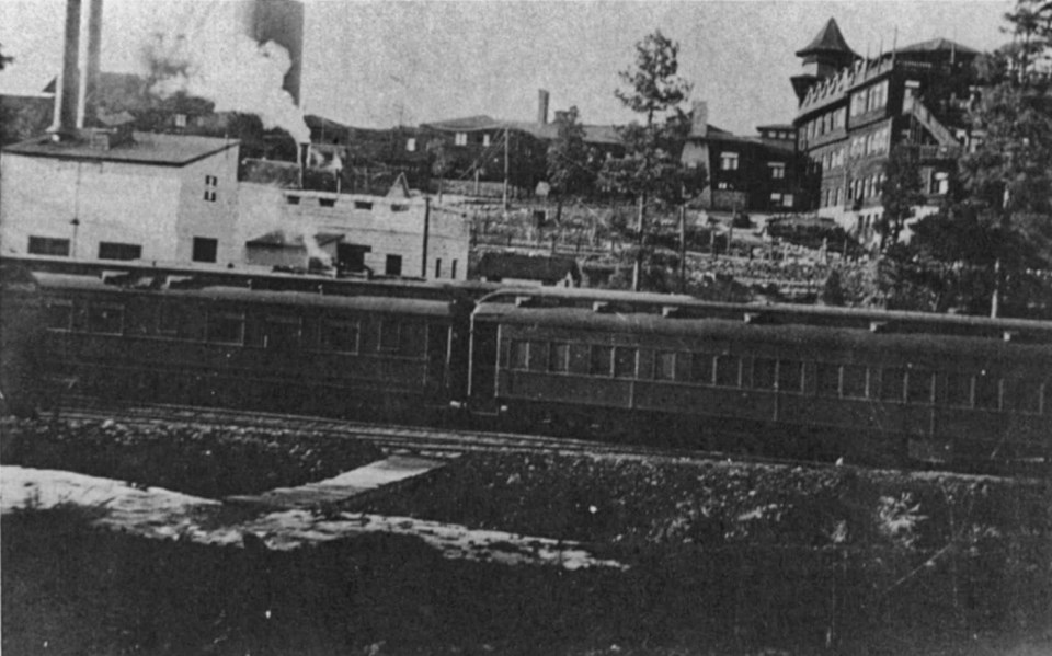 Train with buildings in background