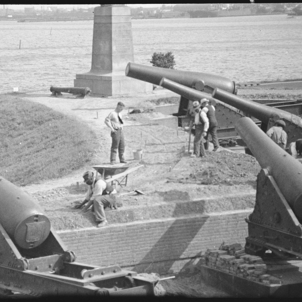 Bricklayers in the 1900’s work under the Rodman Canons as they place a crucial pathway around sections of the Fort, which would become guiding walkways.