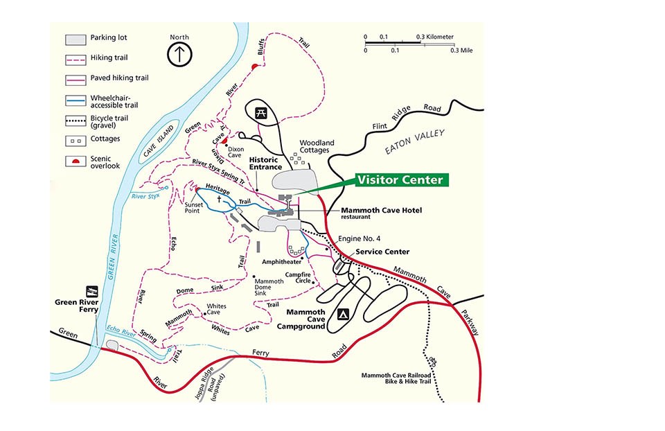 A labeled map of a visitor services area, showing the Green River running north/south on the western edge, and entry roads to the south and east. Campground loops, a visitor center and other features, and a network of trails are identified by symbols.