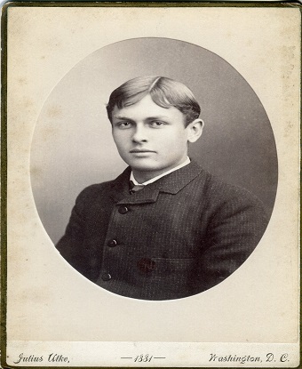 a black and white photo showing a young man 