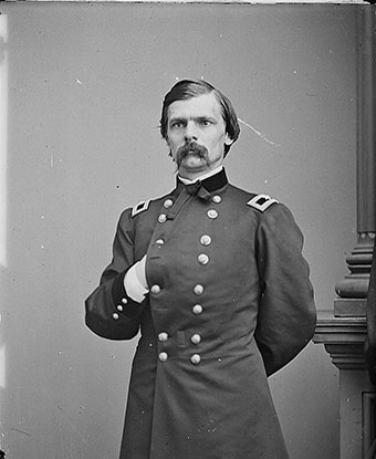 Portrait photograph of George C. Strong standing in military uniform