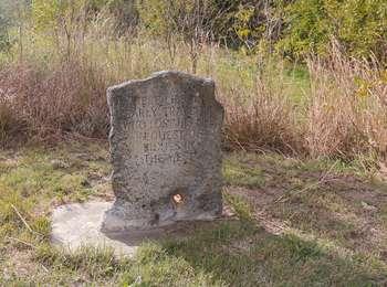 Headstone with inscription marking the grave of an emigrant who perished on the Oregon Trail