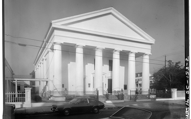 Black and white photo of Greek Doric temple-style church. 