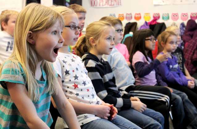 Students watch a program and are excited to learn