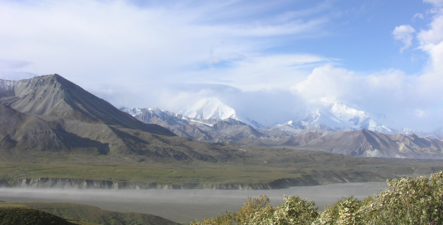 clouds sweep over mountains