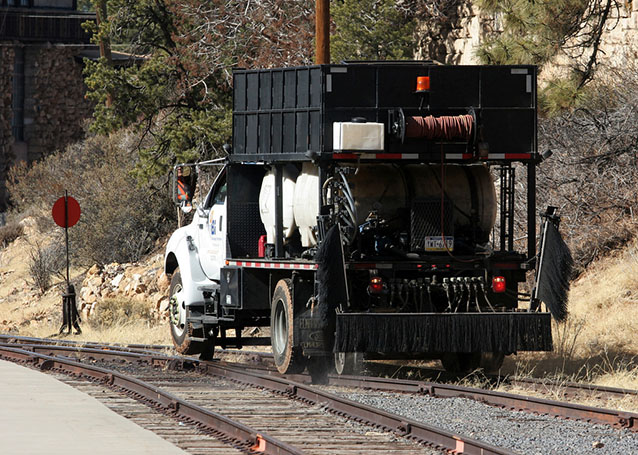 Applying herbicide along railroad tracks within Grand Canyon National Park 