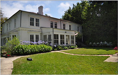 Large white building with a lawn served as the officer's quarters.