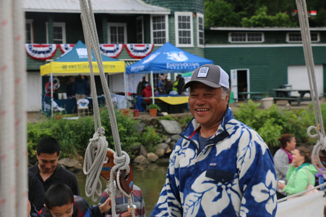 Captain Kalepa Baybayan smiles and greets guests aboard the Hōkūleʻa.