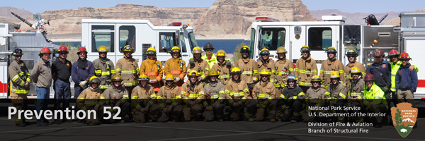 Group of NPS firefighters in front of a fire engine truck