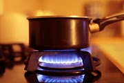 saucepan on a working gas stove burner