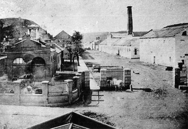 Historic image of buildings lining an unpaved street