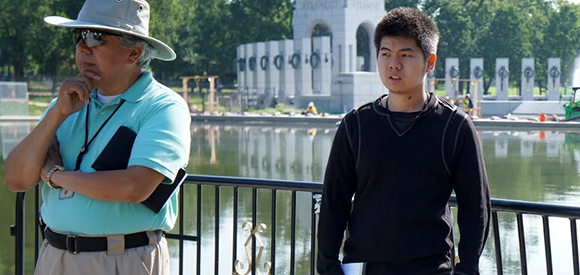 young volunteer intern at the National Mall park with his mentor. 