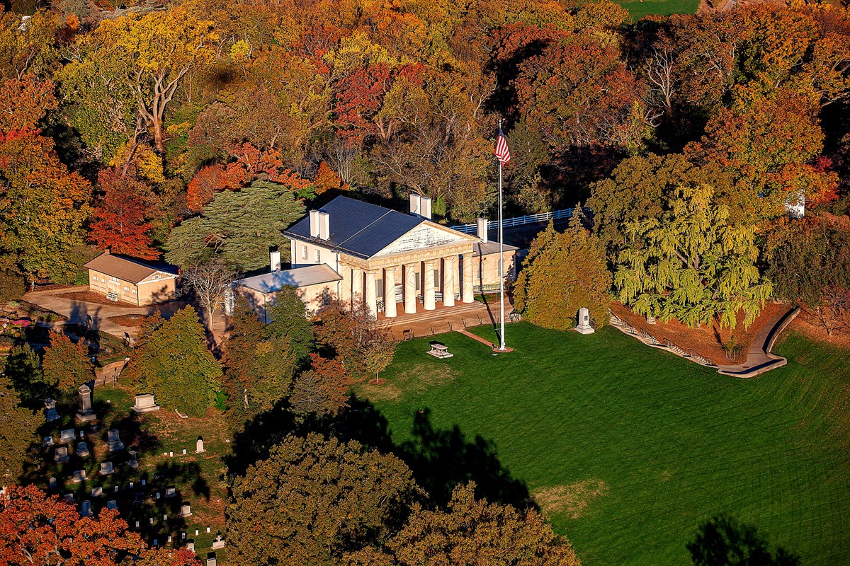 Aerial view of Arlington House surrounded by fall foliage.