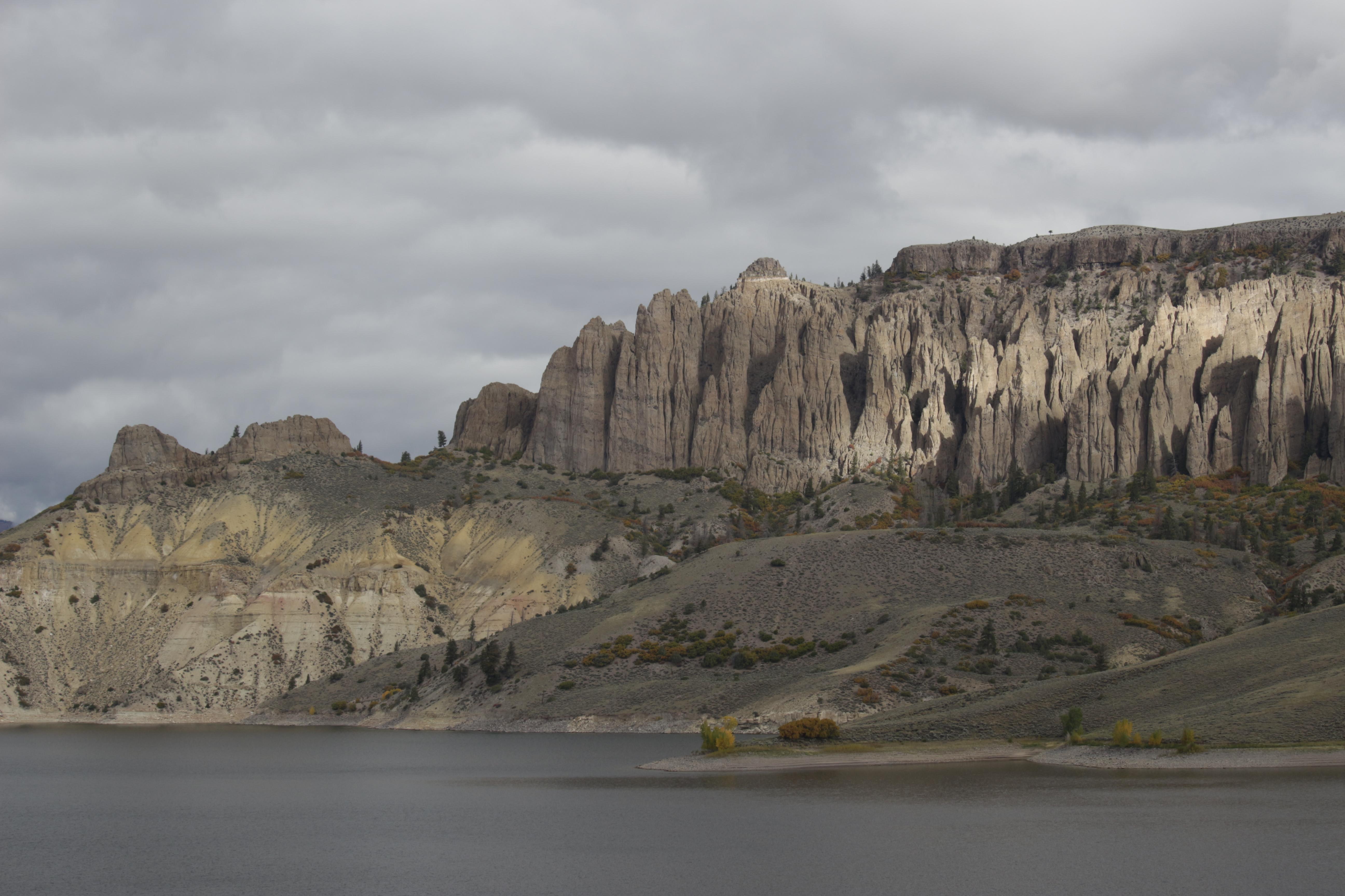 Large pinnacle spires across a body of water