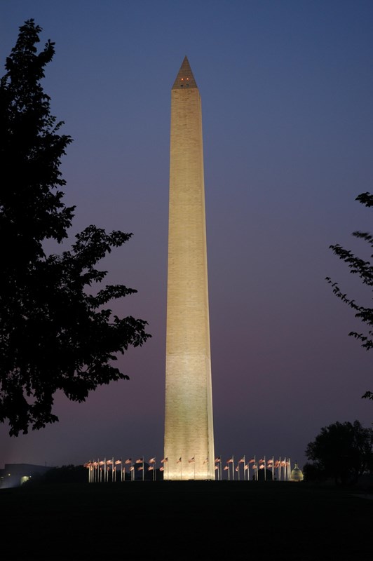 Washington Monument lit at night.