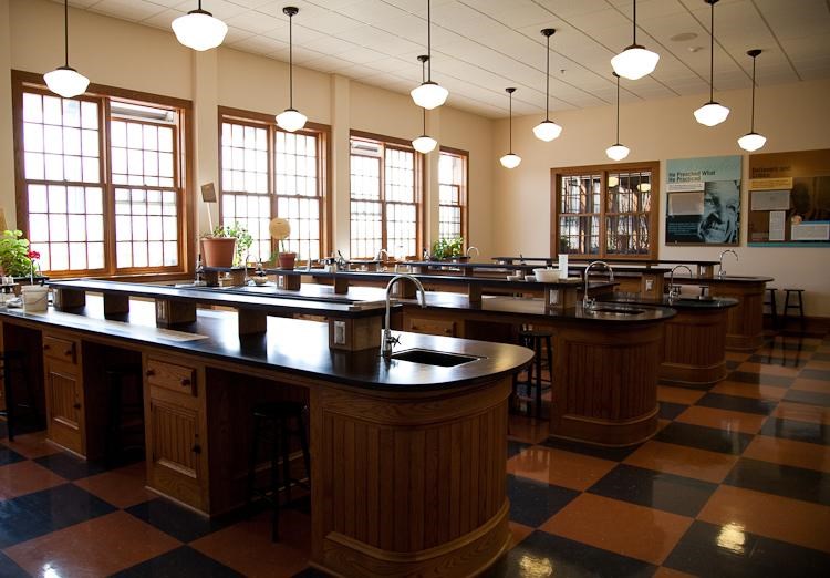 Park's science classroom with lab tables and wall exhibits on George Washington Carver. 