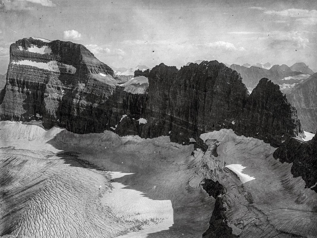 a black and white landscape of a big glacier and mountains 