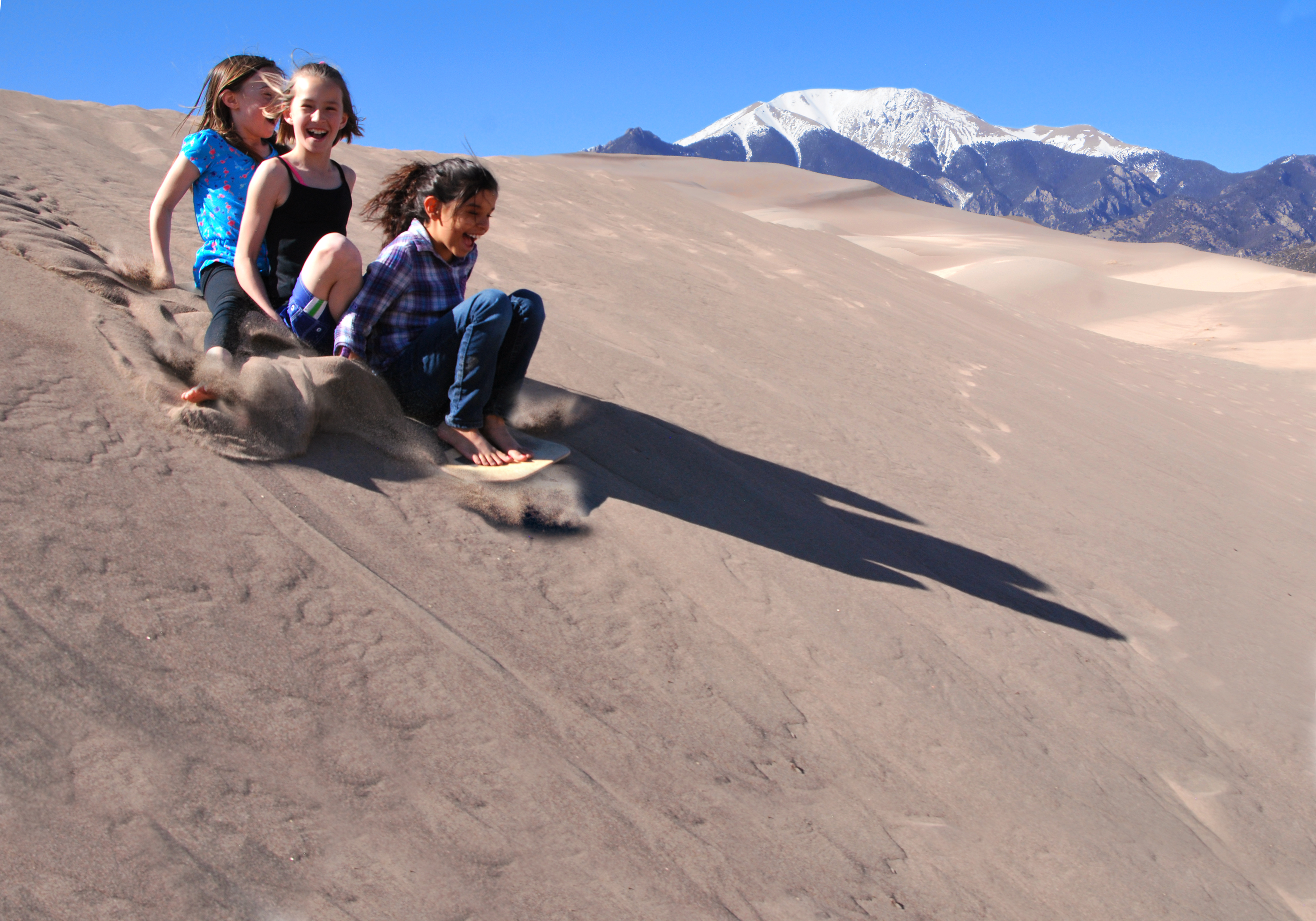 Girls Sand Sledding