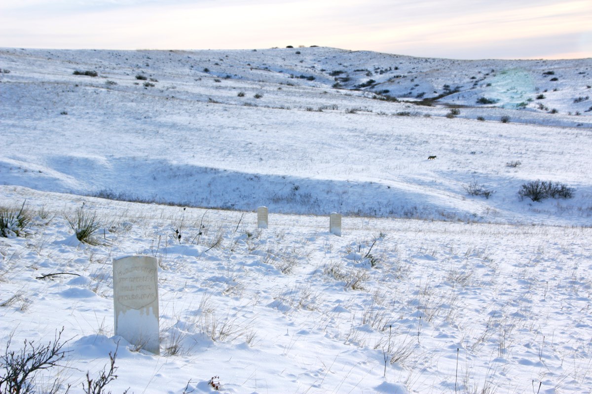 Headstone can still been seen even with the fresh snow that blankets the battlefield . 