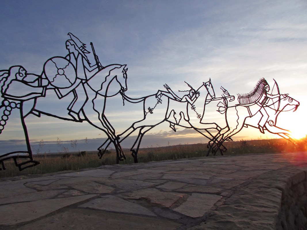 The sun sets behind the Indian Memorial. 