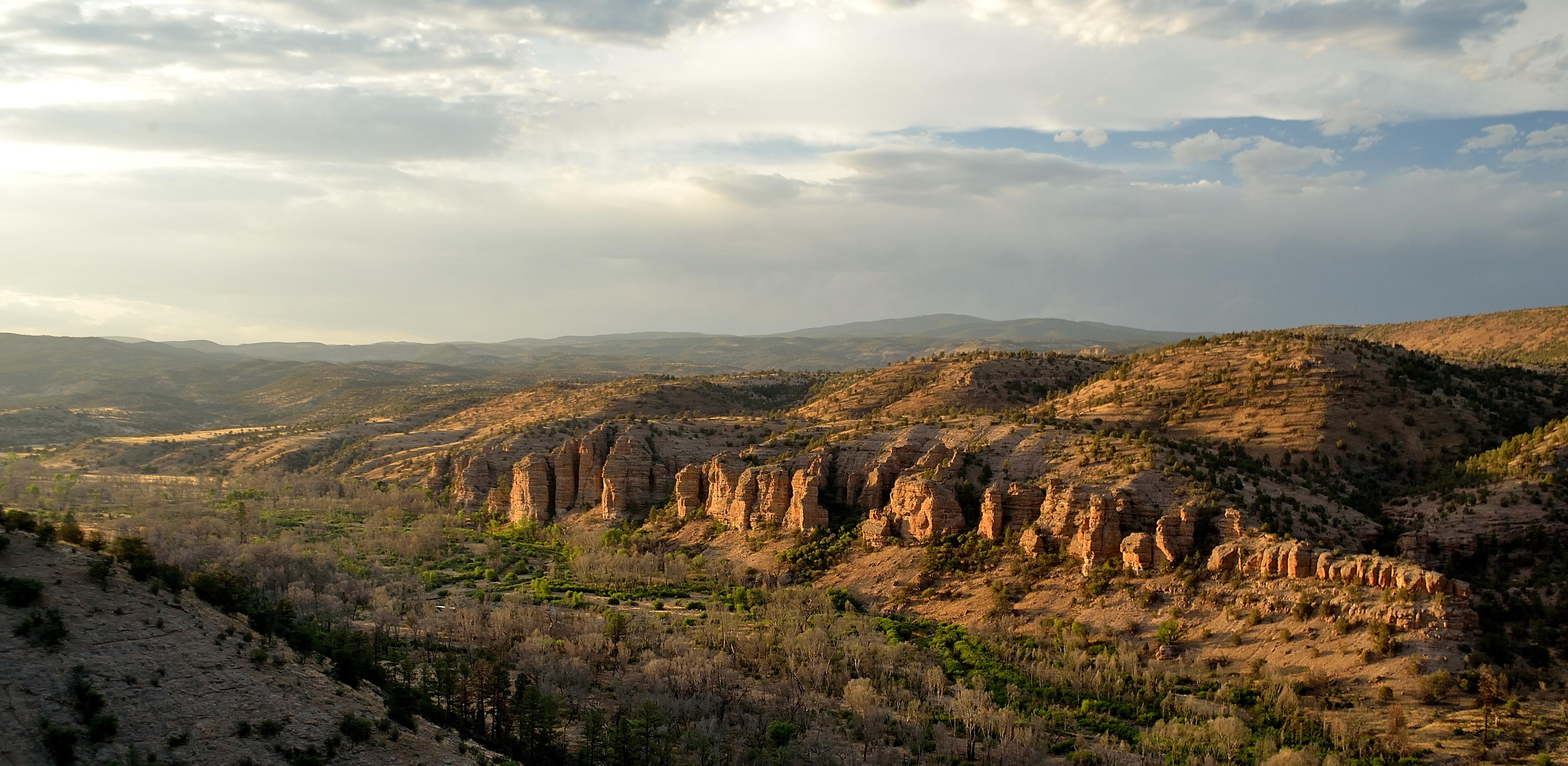 Distant view of Gila river valley and mountains beyond.