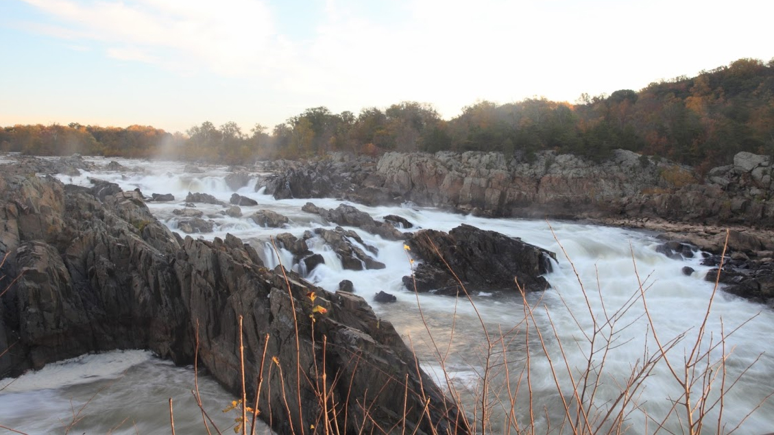 Water rushes over jagged rocks