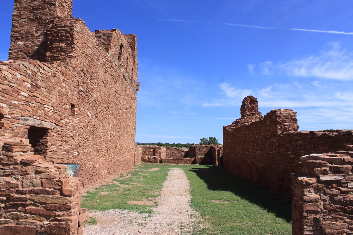 A path through stone walls of an old church. 