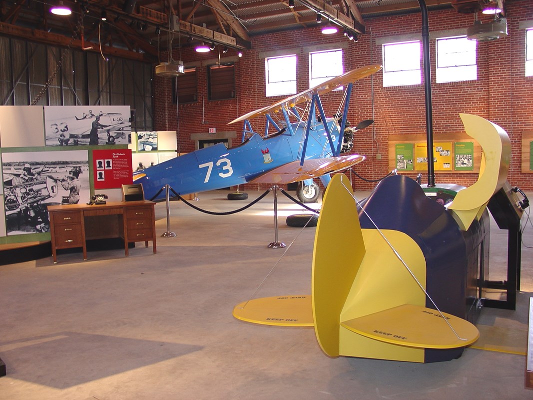 A World War II flight simulator and PT-17 bi-wing training plane 