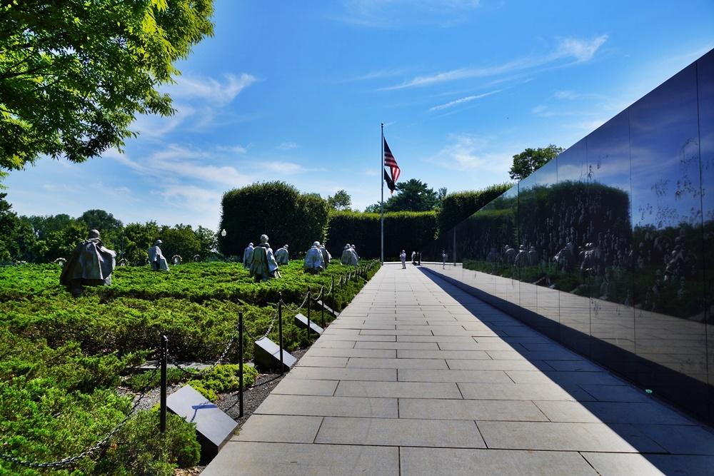 The American flag is centered in the backgrounds between two walkways.