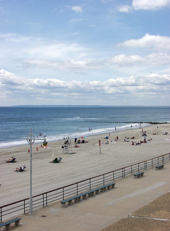 Visitors enjoying the sun and sand at Jacob Riis Park