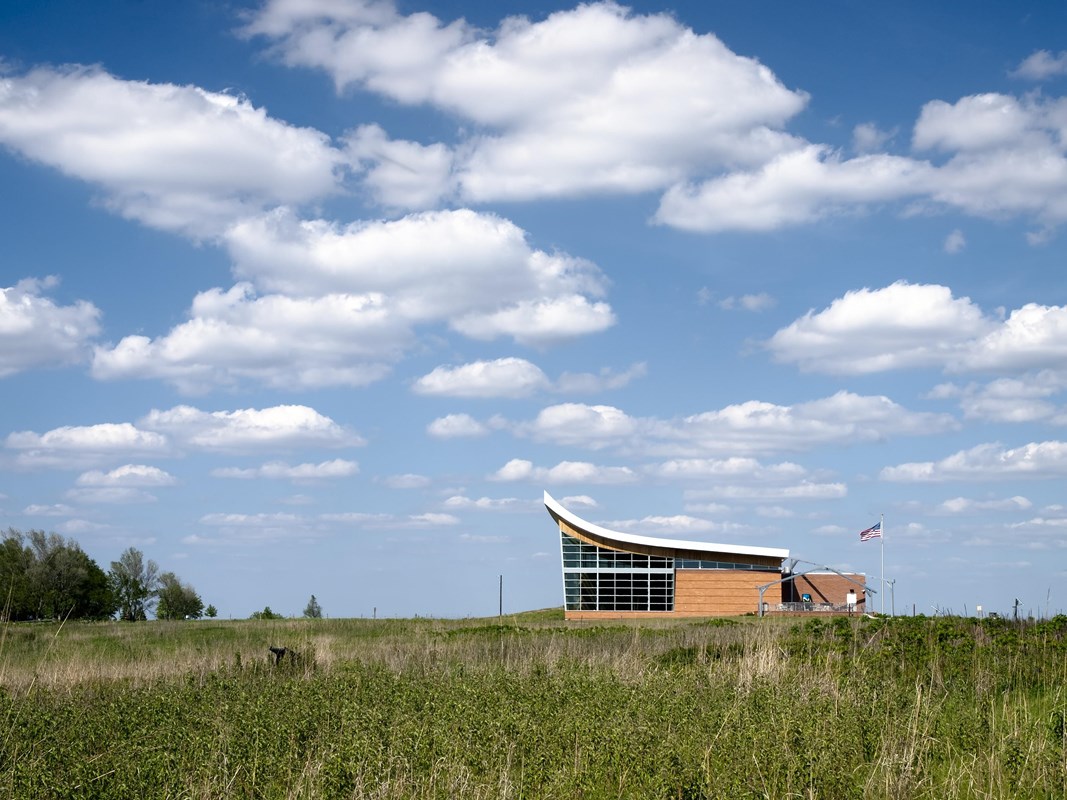 Image of the Heritage Center building surrounded by prairie grass.