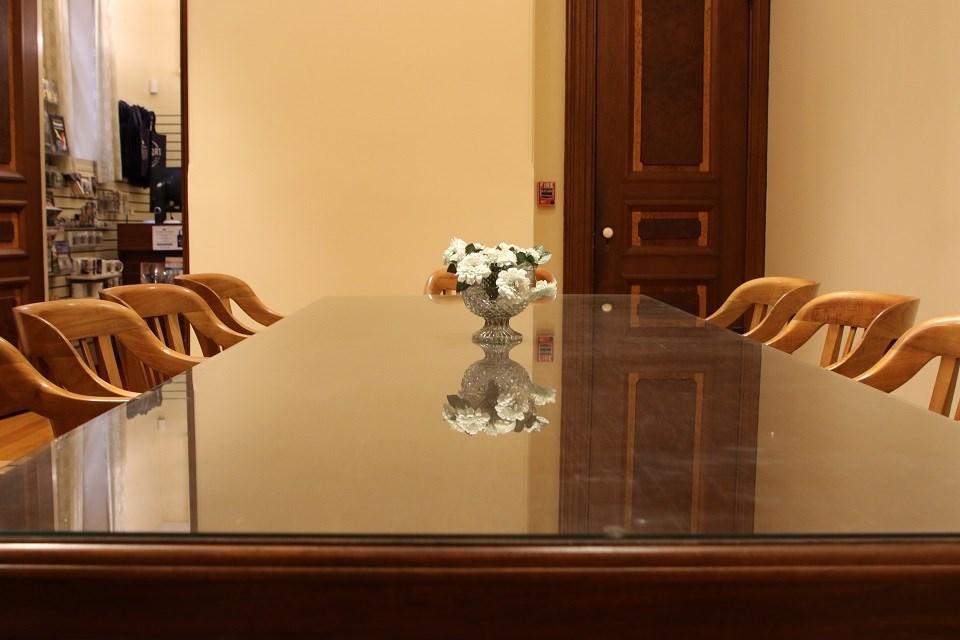 Table with glass table top and wooden chairs