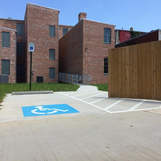 The backs of the three restored homes that make up the Woodson Home NHS with accessibility