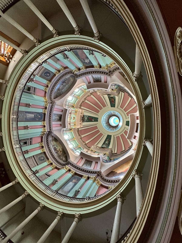 looking up at a very ornate decorated ceiling of many levels