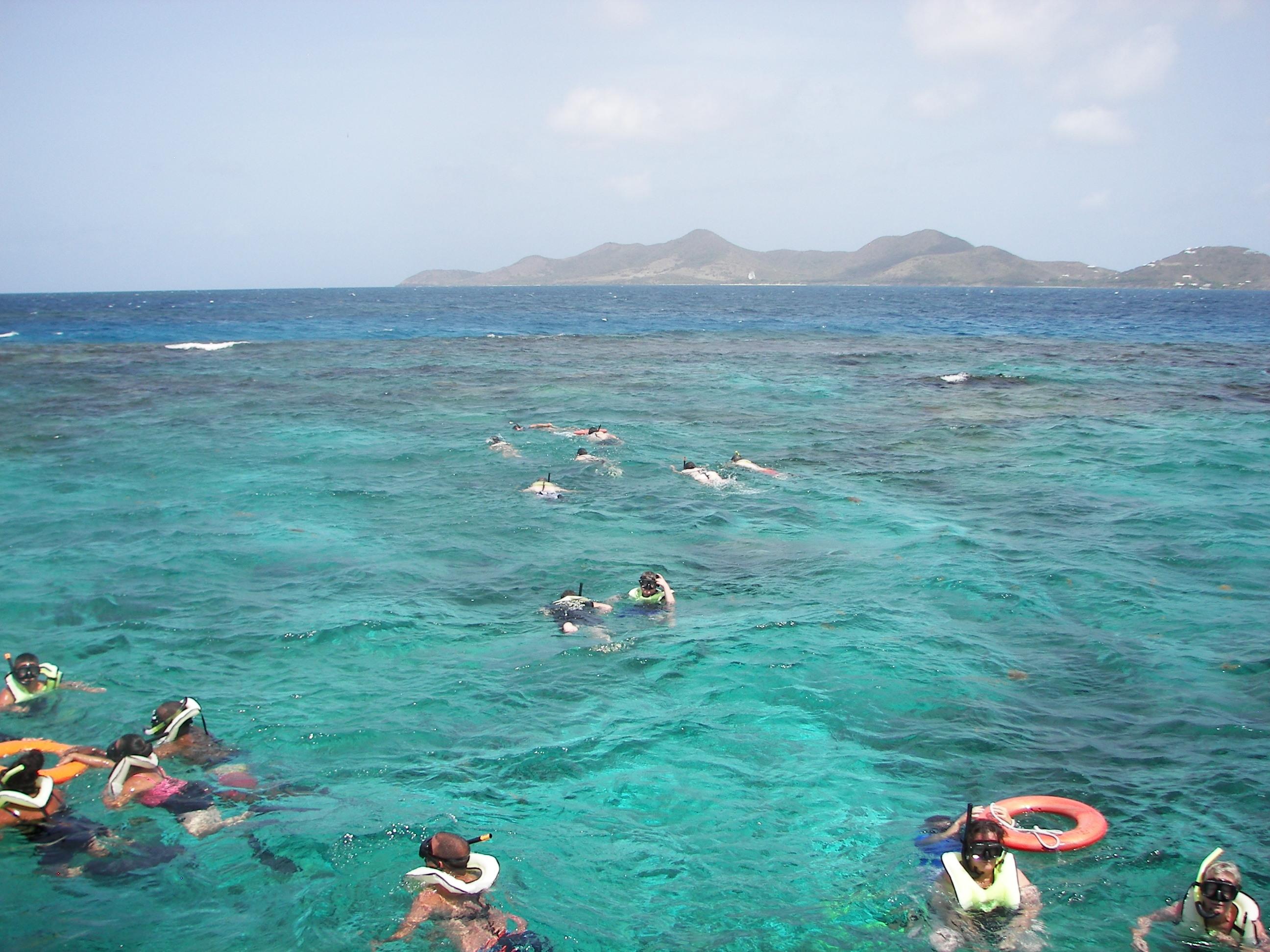 Snorkelers in formation departing the concessioner's vessel in route to the underwater trail.